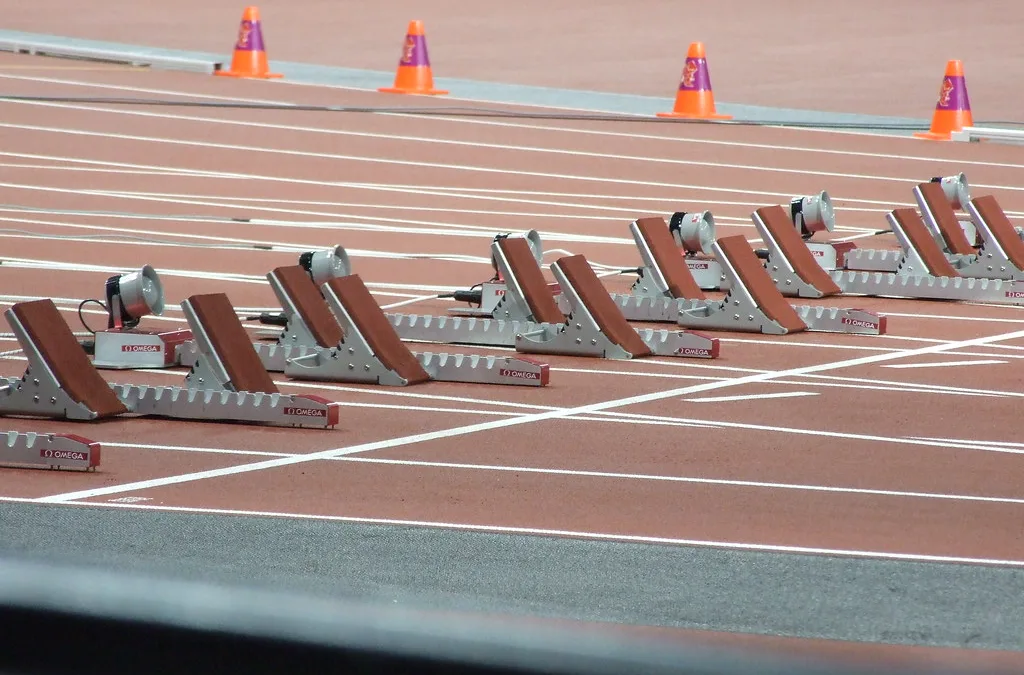 Sprinters in starting blocks, ready to return to competition